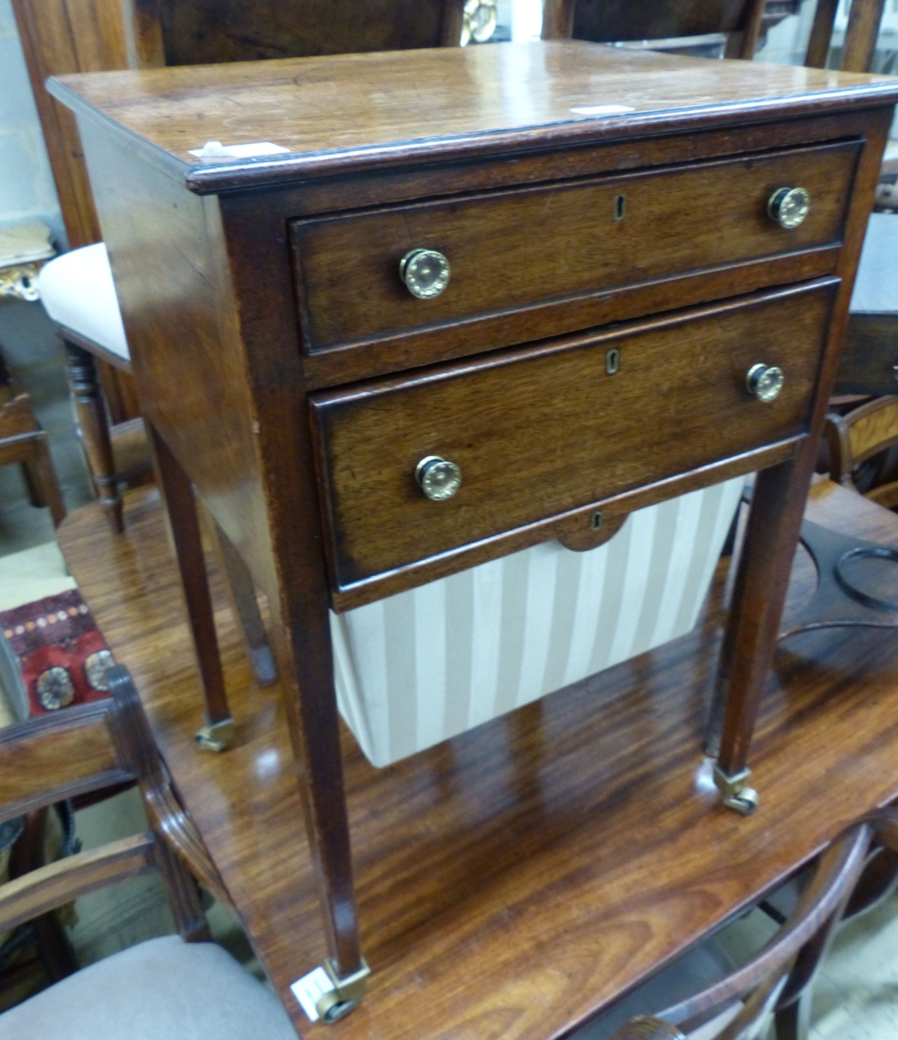 A George III mahogany work table, with two frieze drawers and silks box, on square legs with castors, W.51cm D.43cm H.74cm